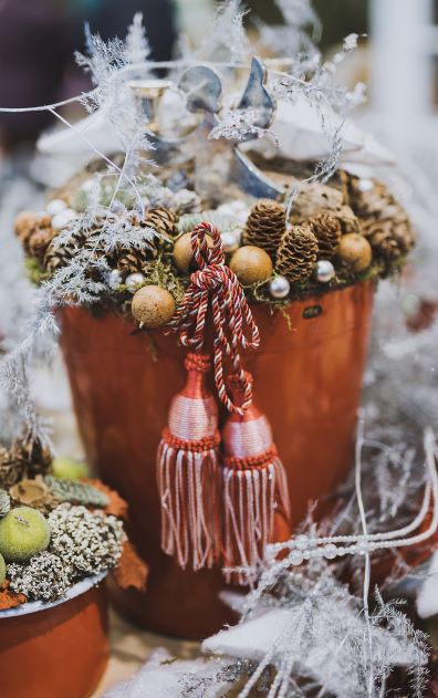 Close Up Photography of Pine Cone in Tassel Bucket as Christmas Decorations