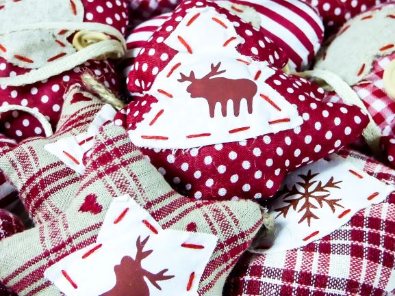 A pile of red and white christmas pillows